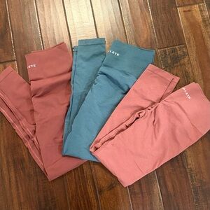 3 Alphalete Women's Leggings - Blue, Red, and Maroon